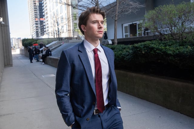 Carter Hart, one of five teammates on Canada's 2018 gold medal-winning world junior hockey team charged with sexually assaulting a woman in a hotel room, leaves the Superior Court of Justice in London, Ontario, Canada April 22, 2025.  REUTERS/Brett Gundlock/File Photo