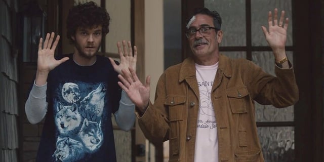 Simon McNally (Jack Quaid) and Ed Deerman (Jeffrey Dean Morgan) with their hands up in 'Neighborhood Watch'