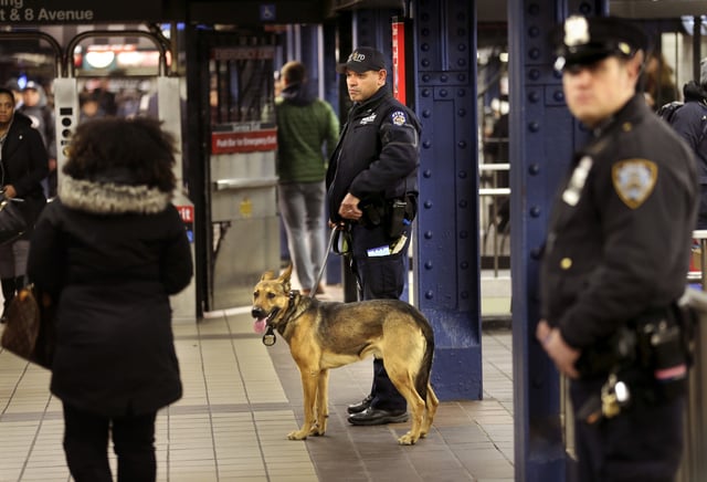 Police officers patrol in the passageway connecting New York City&#39;s Port Authority bus terminal and the Times Square subway station, Dec. 12, 2017.