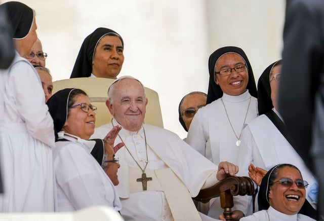 Pope Francis with nuns at the end of his weekly general audience in St. Peter's Square in 2022. 