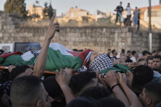 Palestinians carry the body of Abdul Khaleq Jbour, 16, who was killed in an Israeli military raid, during his funeral at the West Bank village of Salem, near Nablus, Friday, April 25, 2025. (AP Photo/Majdi Mohammed)