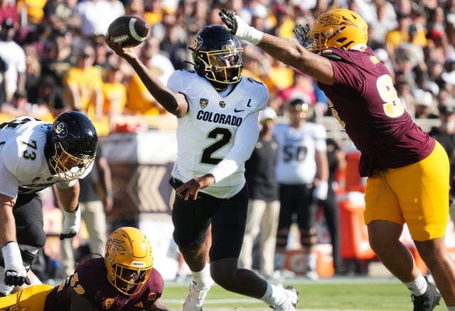 ASU Sun Devils defensive lineman Anthonie Cooper (96) tries to block the pass of Colorado Buffaloes quarterback Shedeur Sanders (2) at Mountain America Stadium.