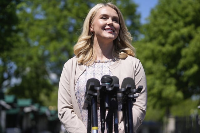 White House press secretary Karoline Leavitt speaks with reporters outside the White House, Wednesday, April 23, 2025, in Washington. (AP Photo/Mark Schiefelbein)