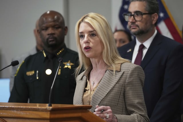 U.S. Attorney General Pam Bondi announces the arrest of gang members involved in four homicides, Friday, April 4, 2025, in Fort Lauderdale, Fla. (AP Photo/Marta Lavandier)