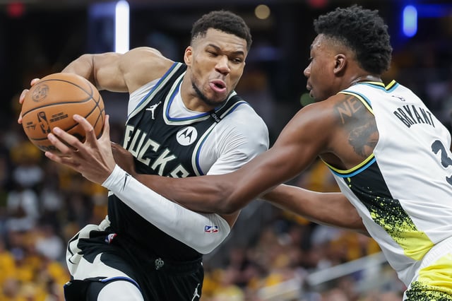 Giannis Antetokounmpo #34 of the Milwaukee Bucks drives to the basket drives to the basket against Thomas Bryant #3 of the Indiana Pacers during the fourth quarter in game one of the NBA playoffs at Gainbridge Fieldhouse on April 19, 2025 in Indianapolis, Indiana.