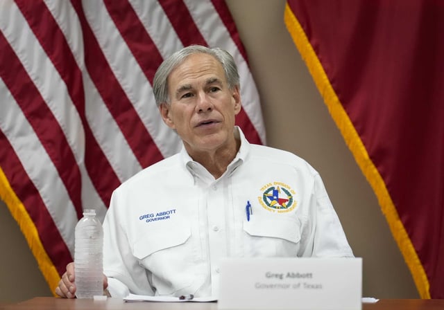 Gov. Greg Abbott, shown in 2024 in Montgomery County, signed an executive order last year requiring hospitals to report the cost of treatment for immigrants who lack permanent legal status.