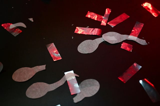 Sperm shaped confetti rests on the floor after a Sperm Racing competition in Los Angeles, California