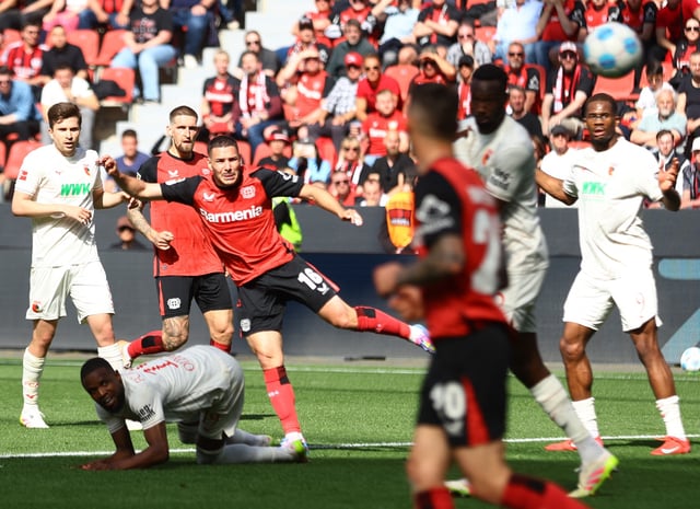 Soccer Football - Bundesliga - Bayer Leverkusen v FC Augsburg - BayArena, Leverkusen, Germany - April 26, 2025 Bayer Leverkusen's Emiliano Buendia scores their second goal REUTERS/Thilo Schmuelgen