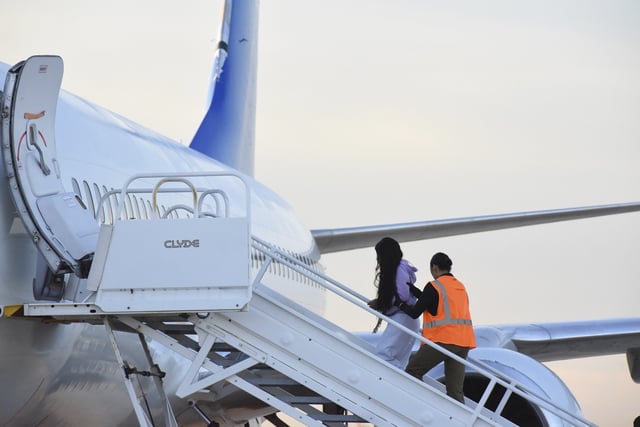 FILE - Venezuelan migrants board a plane heading back to their home country from Harlingen, Texas, on Wednesday, Oct. 18, 2023. (AP Photo/Valerie Gonzalez, File)
