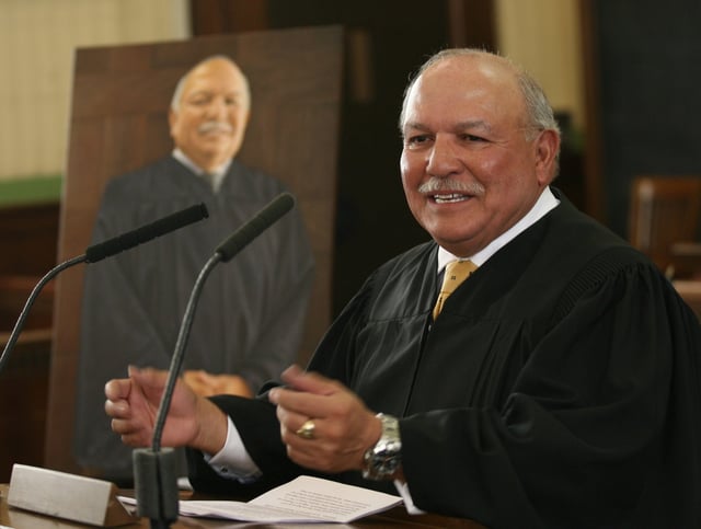 Senior U.S. District Judge David Briones spoke following the unveiling of his painting Monday afternoon at the U.S. Courthouse in Downtown El Paso.
