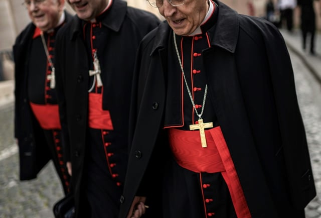 Cardinals walk near the Vatican ahead of Pope Francis's funeral