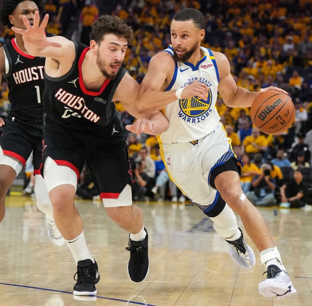 Golden State Warriors guard Stephen Curry (30) works the ball against Houston Rockets center Alperen Sengün (28) during the second half of Game 3 of a first-round NBA playoff basketball series at ChaseCenter in San Francisco, Saturday, April 26, 2025.