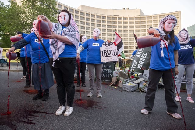 Pro-Palestinian protesters rally outside the Washington Hilton during the White House Correspondents Dinner, Saturday, April 26, 2025, in Washington. (AP Photo/Kevin Wolf)