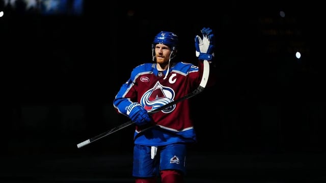 Mar 25, 2025; Denver, Colorado, USA;  First star of the game Colorado Avalanche left wing Gabriel Landeskog (92) following win over the Dallas Stars at Ball Arena. Mandatory Credit: Ron Chenoy-Imagn Images