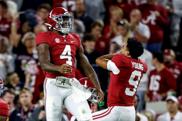 Oct 8, 2022; Tuscaloosa, Alabama, USA; Alabama Crimson Tide quarterback Jalen Milroe (4) celebrates with quarterback Bryce Young (9) after throwing a touchdown pass against the Texas A&M Aggies during the first half at Bryant-Denny Stadium. Mandatory Credit: Butch Dill-USA TODAY Sports