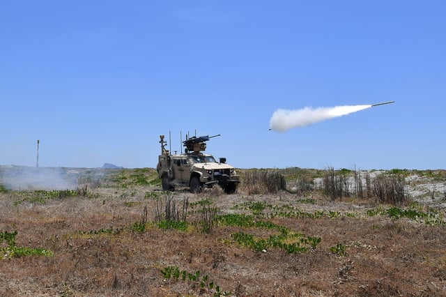 US marines fire MADIS counter drone system during the annual US-Philippines joint military exercise "Balikatan" at a naval training base in San Antonio town on april 27, 2025