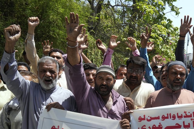 Members of the Awami Rickshaw Union chant slogans during a demonstration against the suspension of water-sharing treaty by India with Pakistan, in Lahore, Pakistan, Sunday, April 27, 2025. (AP Photo/K.M. Chaudary)