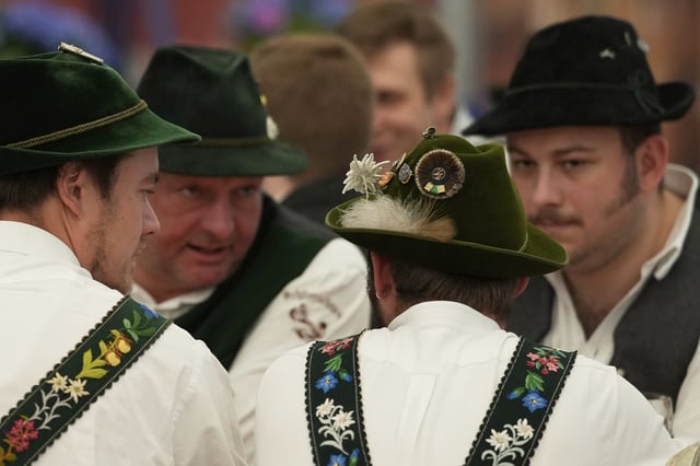 Men dressed in traditional clothes attend the German Championships in Fingerhakeln or finger wrestling, in Pang, near Rosenheim, Germany, Sunday, April 27, 2025. (AP Photo/Matthias Schrader)