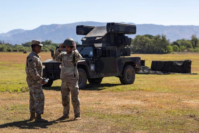 U.S. soldiers talk beside an Avenger Air Defense System during the annual joint military exercises between U.S. and Philippine troops called "Balikatan" or shoulder-to-shoulder, at a naval base in San Antonio, Zambales province, Philippines, April 27, 2025. REUTERS/Eloisa Lopez