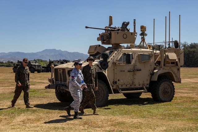 Philippine and U.S. soldiers walk past a MADIS or Marine Air Defense Integrated System during the annual joint military exercises between the U.S. and Philippine troops called "Balikatan" or shoulder-to-shoulder, at a naval base in San Antonio, Zambales province, Philippines, April 27, 2025. REUTERS/Eloisa Lopez