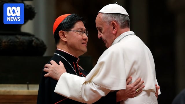 Pope Francis hugs Filipino Cardinal Luis Antonio Tagle.