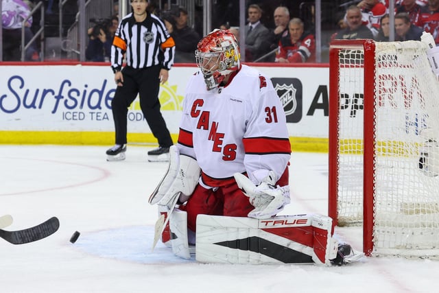 Apr 25, 2025; Newark, New Jersey, USA; Carolina Hurricanes goaltender Frederik Andersen (31) makes a save against the New Jersey Devils during the first overtime in game three of the first round of the 2025 Stanley Cup Playoffs at Prudential Center. Mandatory Credit: Ed Mulholland-Imagn Images/File Photo