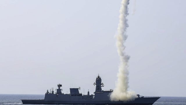 An Indian warship demonstrates its long-range precision strike capability during a drill in the Arabian Sea on Sunday. (PTI)