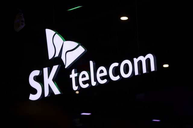 The logo of SK Telecom is pictured at the GSMA's 2023 Mobile World Congress (MWC) in Barcelona, Spain February 28, 2023. REUTERS/Nacho Doce/File Photo