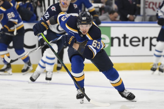 Apr 27, 2025; St. Louis, Missouri, USA; St. Louis Blues left wing Jake Neighbours (63) skates against the Winnipeg Jets during the second period in game four of the first round of the 2025 Stanley Cup Playoffs at Enterprise Center. Mandatory Credit: Jeff Le-Imagn Images