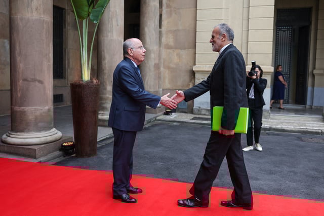 Brazilian Foreign Minister Mauro Vieira and Iranian Deputy Foreign Minister on Economic Diplomacy, Seyed Rasoul Mohajer shake hands, on the day of the BRICS Meeting of Ministers of Foreign Affairs in Rio de Janeiro, Brazil, April 28, 2025. REUTERS/Pilar Olivares