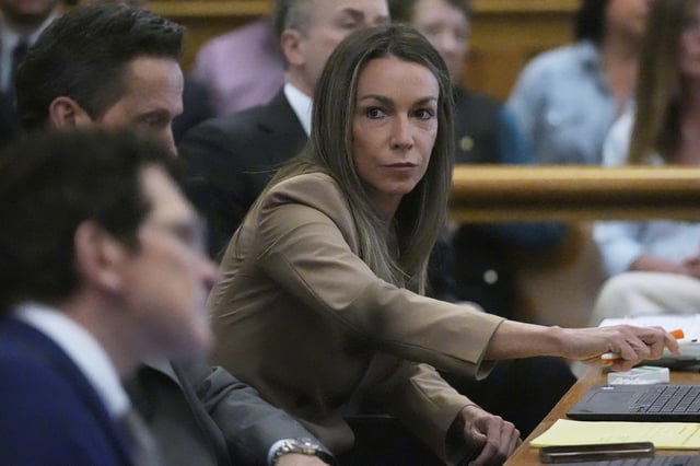 Karen Read sits with her defense team during her trial, Thursday, April 24, 2025, at Norfolk Superior Court in Dedham, Mass.
