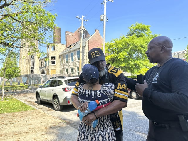 Sadyya Rockett-Miller and her husband Andre LeMoyne Miller grieve outside of the historic Clayborn Temple, a landmark from the civil rights movement with ties to Martin Luther King, that caught fire Monday, April 28, 2025, in Memphis, Tenn. (AP Photo/Karen Pulfer Focht)