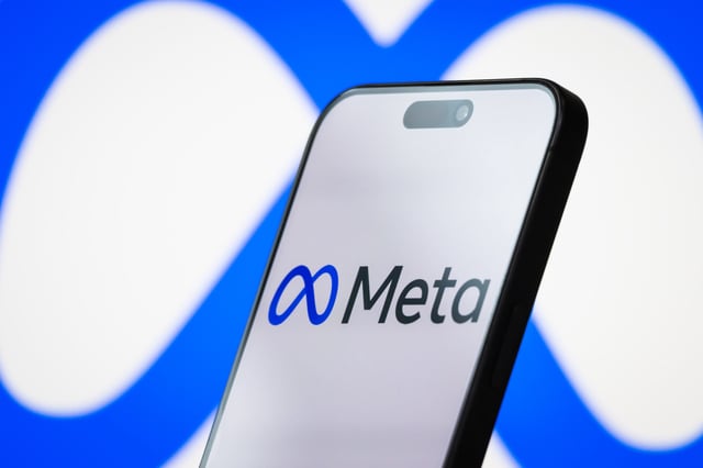 Stock Image: the logo of Meta Platforms, Inc. is displayed on a smartphone screen, with the company&#39;s infinity loop-style branding visible in the background, on April 26, 2025, in Chongqing, China.