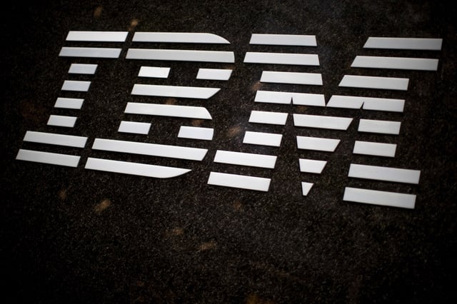 FILE – In this April 26, 2017, file photo, the IBM logo is displayed on the IBM building in Midtown Manhattan, in New York. IBM announced Sunday, Oct. 28, 2018, it will acquire North Carolina-based open-source software company Red Hat in a $34 billion stock deal that the technology and consulting giant’s chief executive says will advance the company to the next step in cloud computing. (AP Photo/Mary Altaffer, File)
