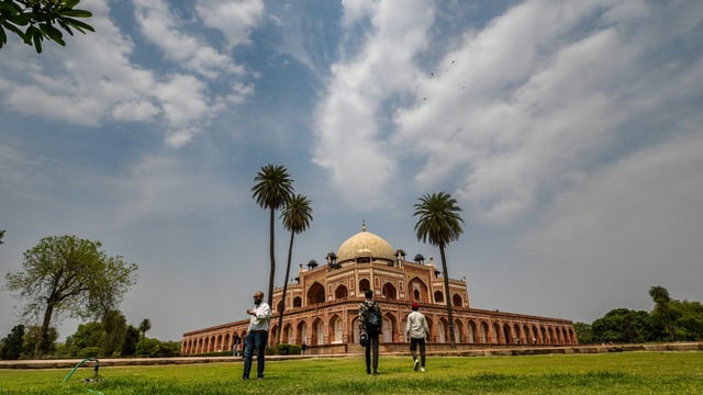 People Enjoy at pleasant weather under the sky at Humayun Tomb in New Delhi, India, on Saturday, April 26, 2025. 