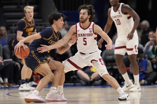 Mar 12, 2025; Charlotte, NC, USA; California Golden Bears guard Andrej Stojakovic (2) handles the ball against Stanford Cardinal guard Benny Gealer (5) during the second half at Spectrum Center. Mandatory Credit: Jim Dedmon-Imagn Images/File Photo