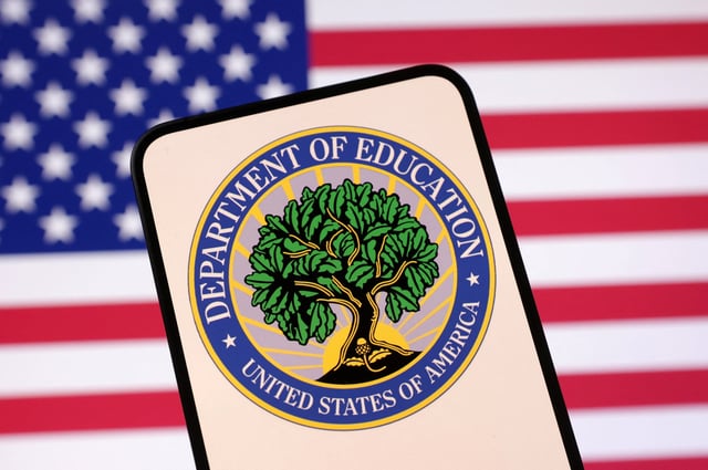 United States Department of Education logo and U.S. flag are seen in this illustration taken April 23, 2025. REUTERS/Dado Ruvic/Illustration/File Photo