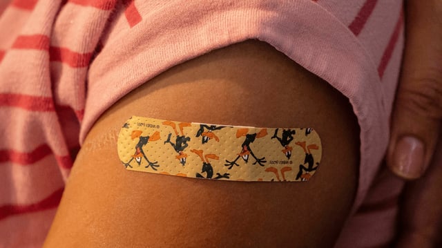 A bandage is seen on a child's arm after she received a Pfizer-BioNtech Covid19 vaccine on November 3, 2021 in Shoreline, Washington.