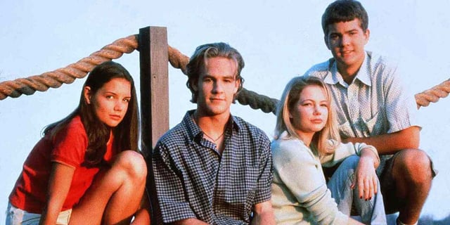 The cast of Dawson's Creek pose on a dock with ropes in the background.