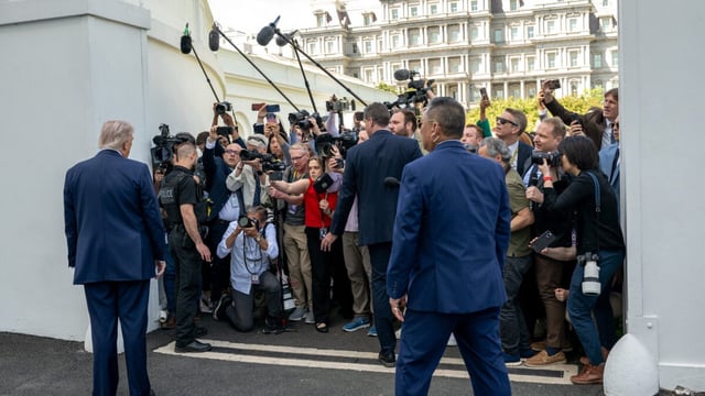 reporters and President Donald Trump