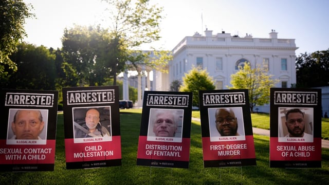 Posters depicting detained illegal immigrants were put up outside the White House on Monday