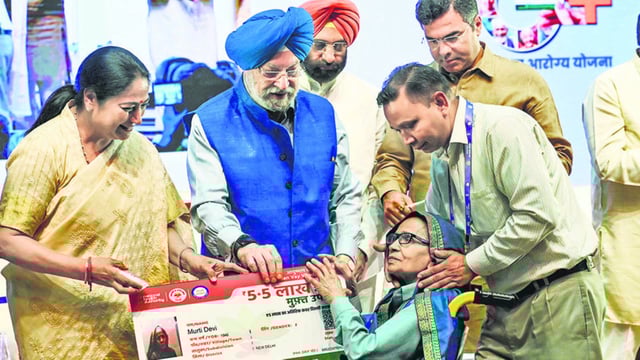 Delhi chief minister Rekha Gupta (left), Union minister Hardeep Singh Puri (centre) and Delhi minister Parvesh Verma (right background) on Monday. (Vipin Kumar/HT photo)