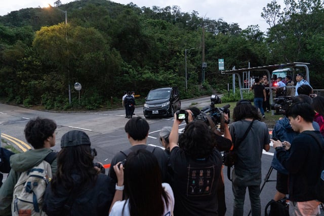 Members of media wait outside the Shek Pik Prison as former pro-democracy lawmaker, Gary Fan, was released after four years for his conviction under the national security law in Hong Kong, Tuesday, April 29, 2025. (AP Photo/Chan Long Hei)