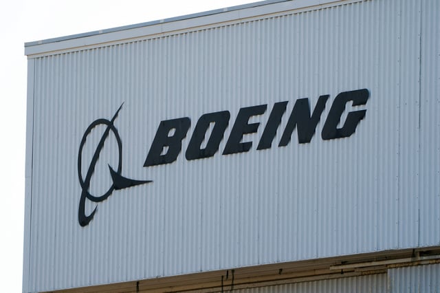 A Boeing sign sits on a building near Boeing Field, as trade tensions escalate over U.S. tariffs with China, in Seattle, Washington, U.S. April 22, 2025.  REUTERS/David Ryder/File Photo