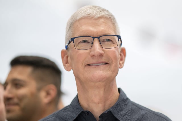 Apple CEO Tim Cook looks at new iPhone models following Apple&#39;s &#34;It&#39;s Glowtime&#34; event in Cupertino, California, September 9, 2024.