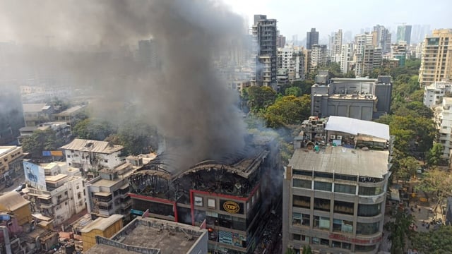 A civic official said the fire broke in the building’s basement but later spread to the upper floors, which were soon filled with smoke.