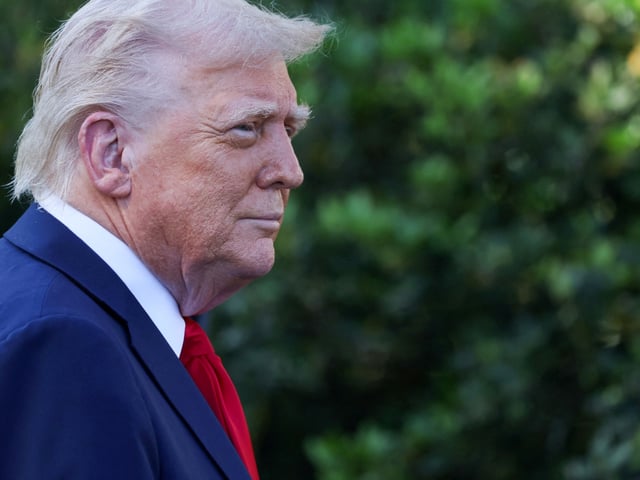 FILE PHOTO: U.S. President Donald Trump looks on, on the day he welcomes the Super Bowl LIX winner, NFL champion Philadelphia Eagles on the South Lawn of the White House in Washington, D.C., U.S., April 28, 2025. REUTERS/Leah Millis/File Photo