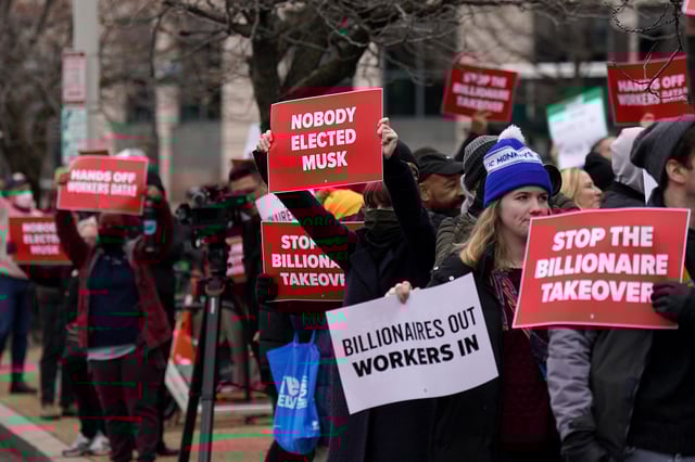 WASHINGTON, DC - FEBRUARY 05: Workers and supporters protest against the Department of Government Efficiency (DOGE) in front of the U.S. Department of Labor (DOL) on February 05, 2025 in Washington, DC. Workers and supporters protested outside ahead of a scheduled meeting between members of Elon Musk’s DOGE staff and DOL management. (Photo by Al Drago/Getty Images)