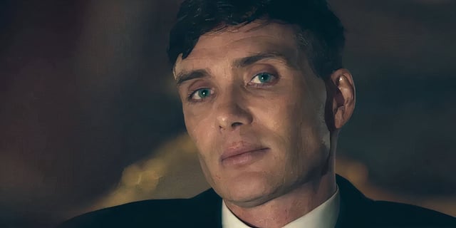 Cillian Murphy as Tommy Shelby in Peaky Blinders looking at the camera.