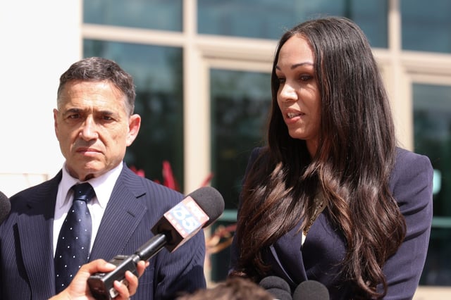 Megan Garcia, with her attorney Matthew Bergman, speaks to members of the media outside the federal courthouse in Orlando after a hearing Monday, April 28, 2025. Garcia is suing Character Technologies, arguing her 14-year-old son, Sewell Setzer, killed himself in February 2024 after getting into an obsessive relationship with one of its chatbots. (Rich Pope, Orlando Sentinel)